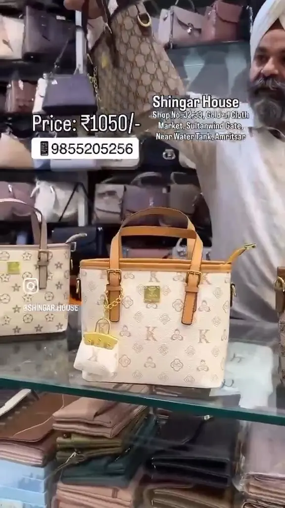 Monogram top-handle totes at the counter