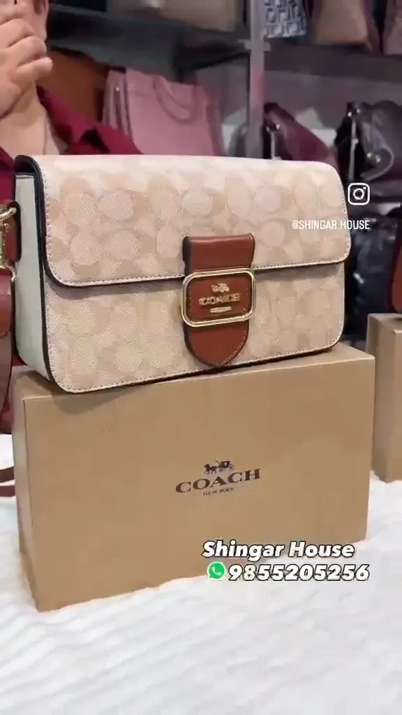 A signature-print crossbody, unboxed